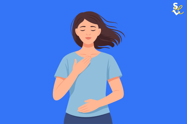 lightness when time feels tight A woman with her hand on her stomach and chest, breathing deeply and looking calm.